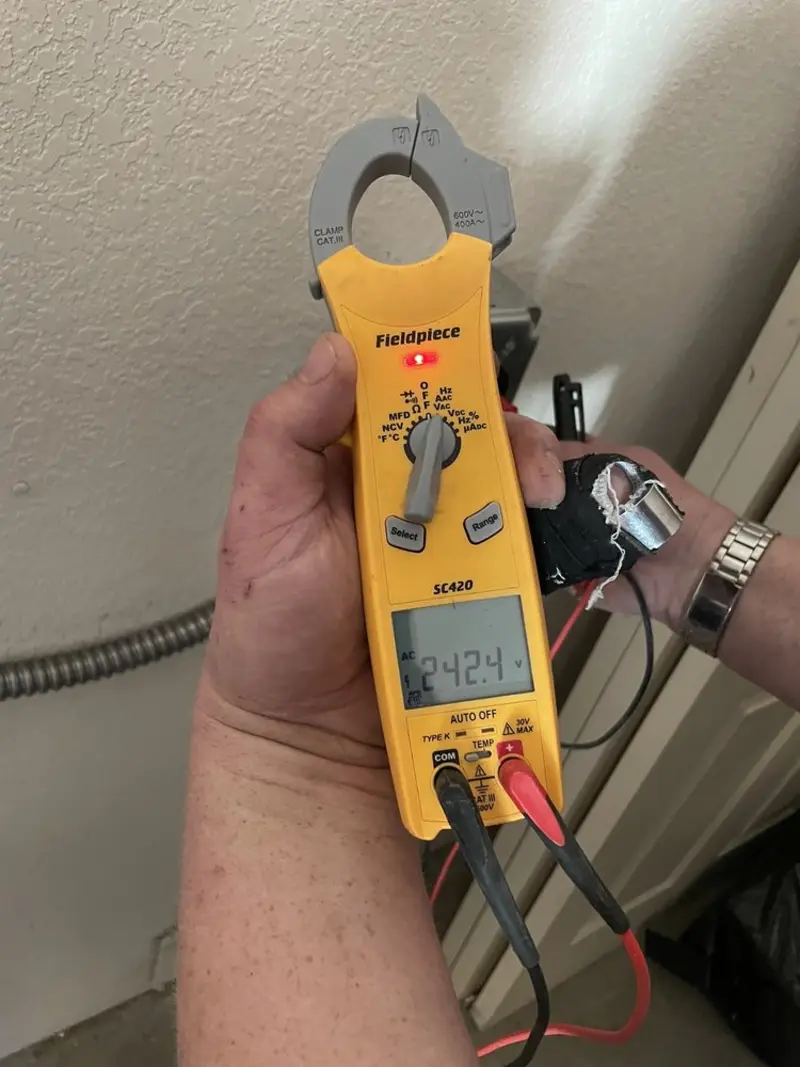 Voltage testing with clamp meter during Outlet Installation in Jessup